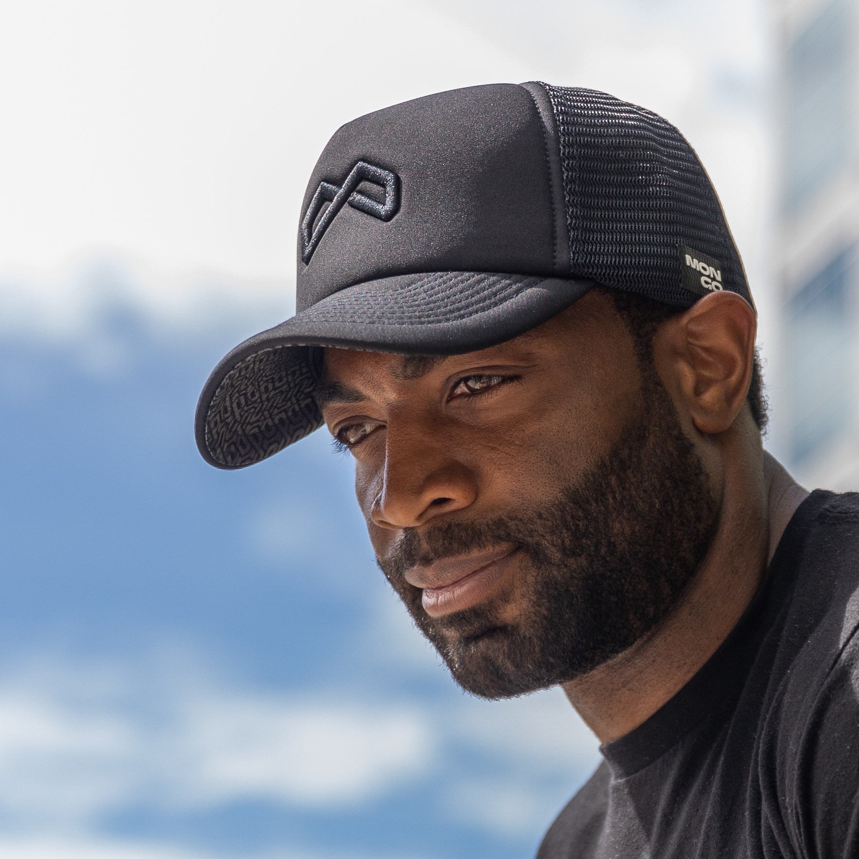 Man wearing an extra large deep-fit snapback hat from Mongo Hats' big head hats collection